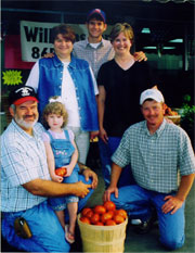 Williams Farm posing with their tomatoes