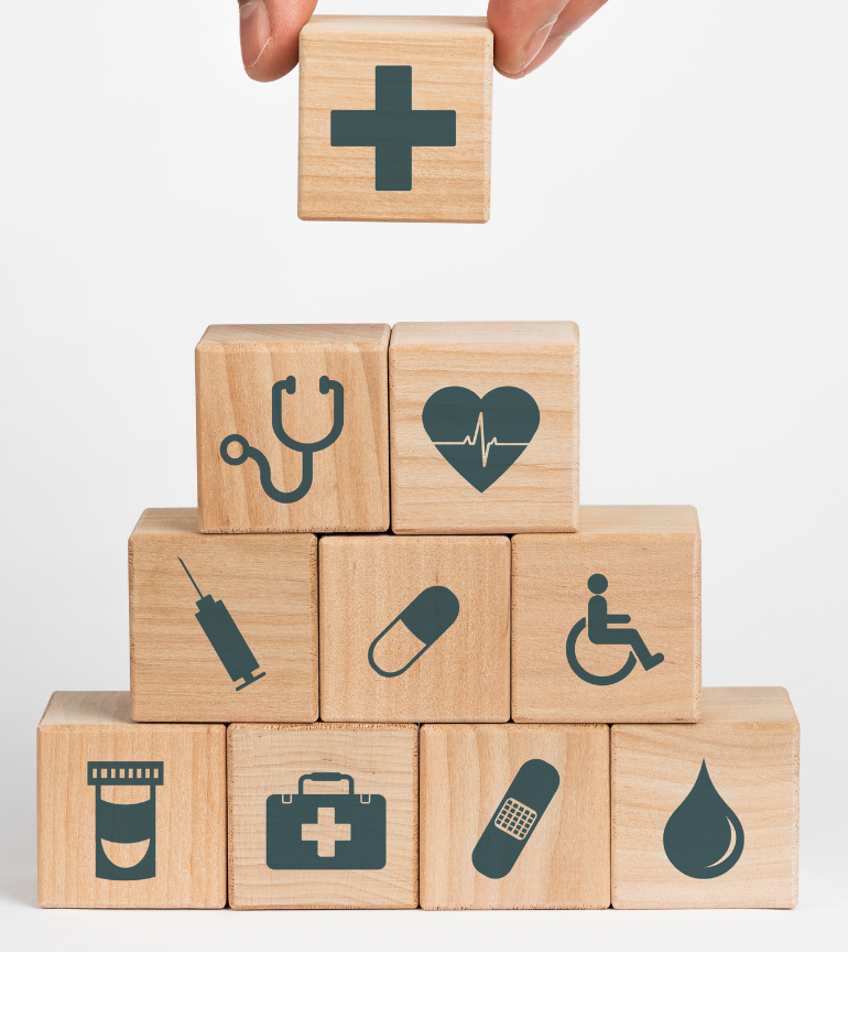 Wooden block pyramid with medical logos on the wooden blocks 