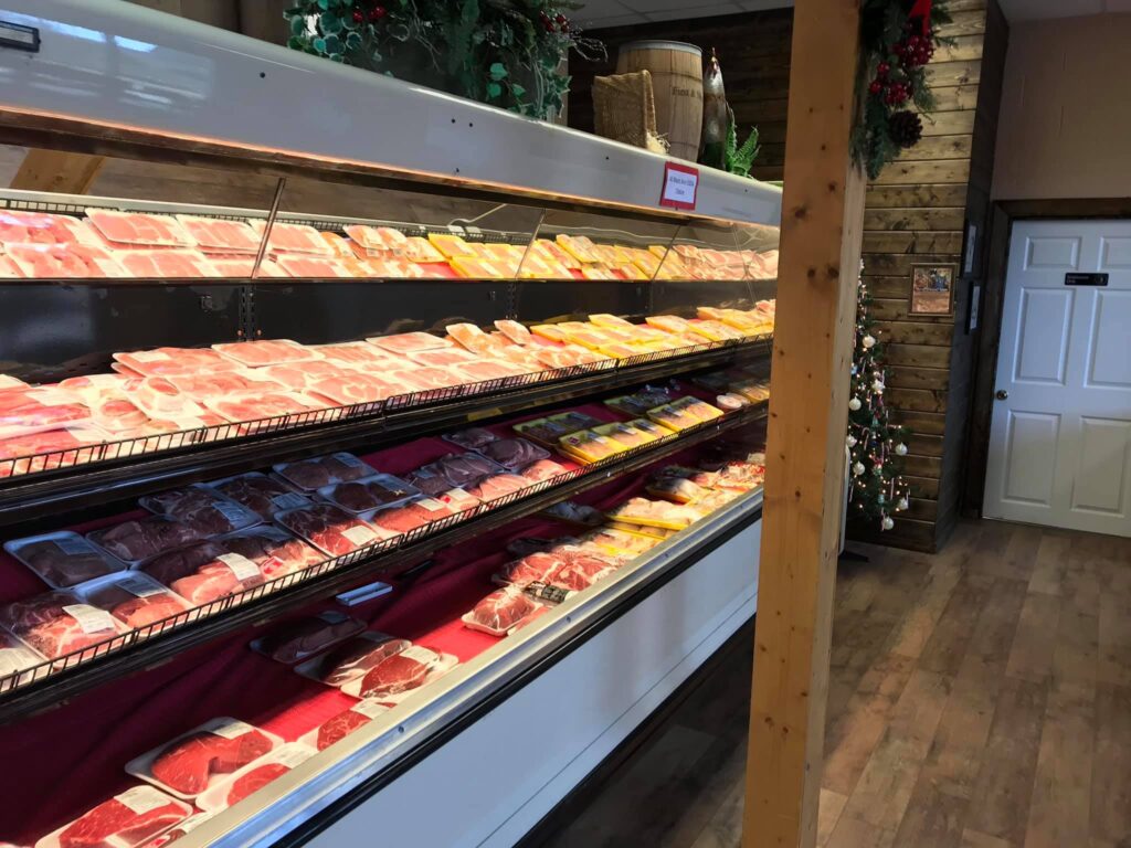 an aisle of freshly packaged meats 